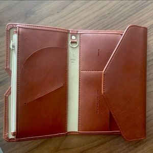 Not real leather, travel wallet. New without tag